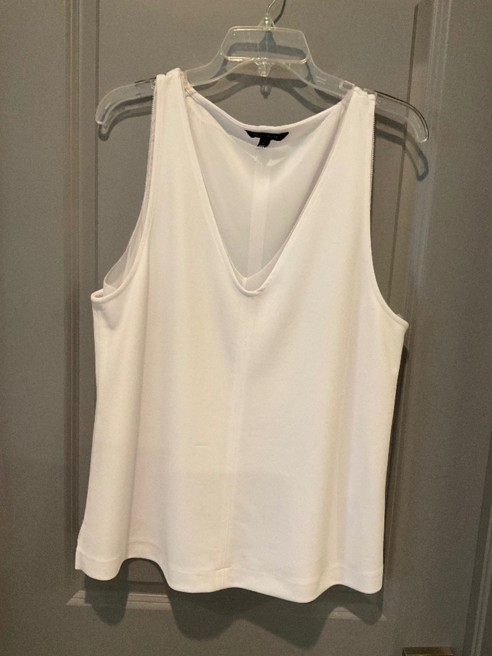 White sleeveless blouse, fully lined